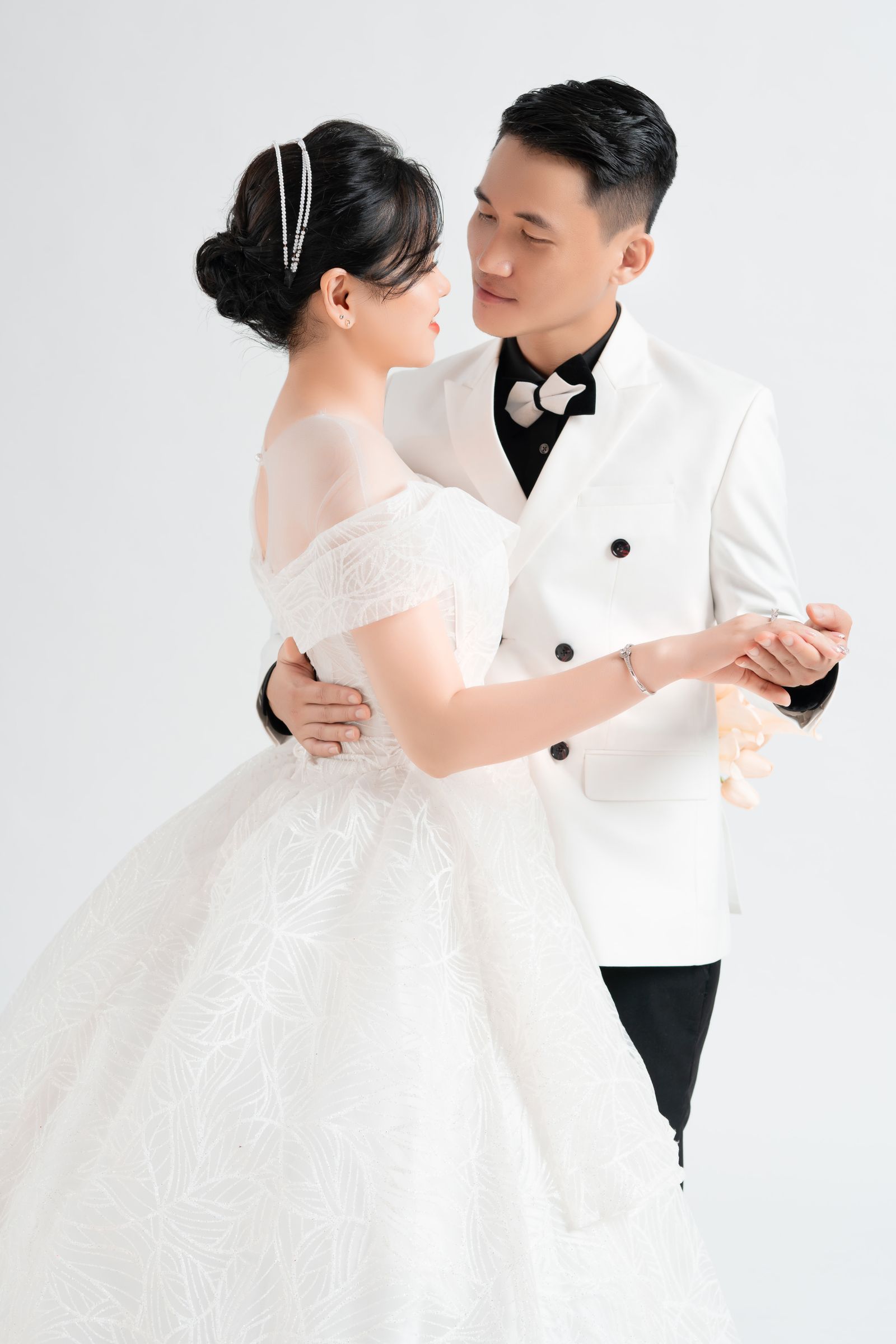 Couple practicing their first dance in a San Diego studio