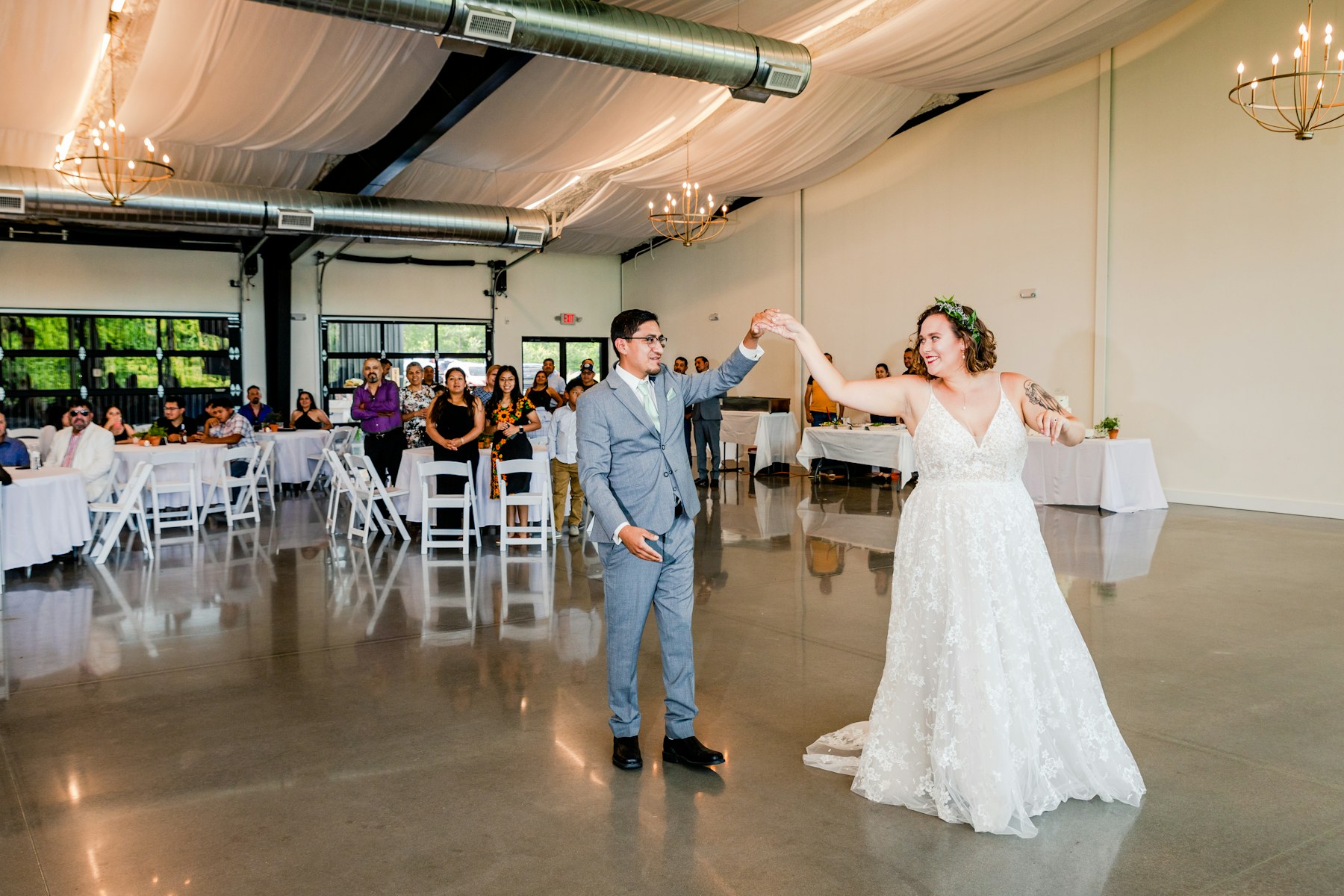 Newlyweds turning together during their wedding reception